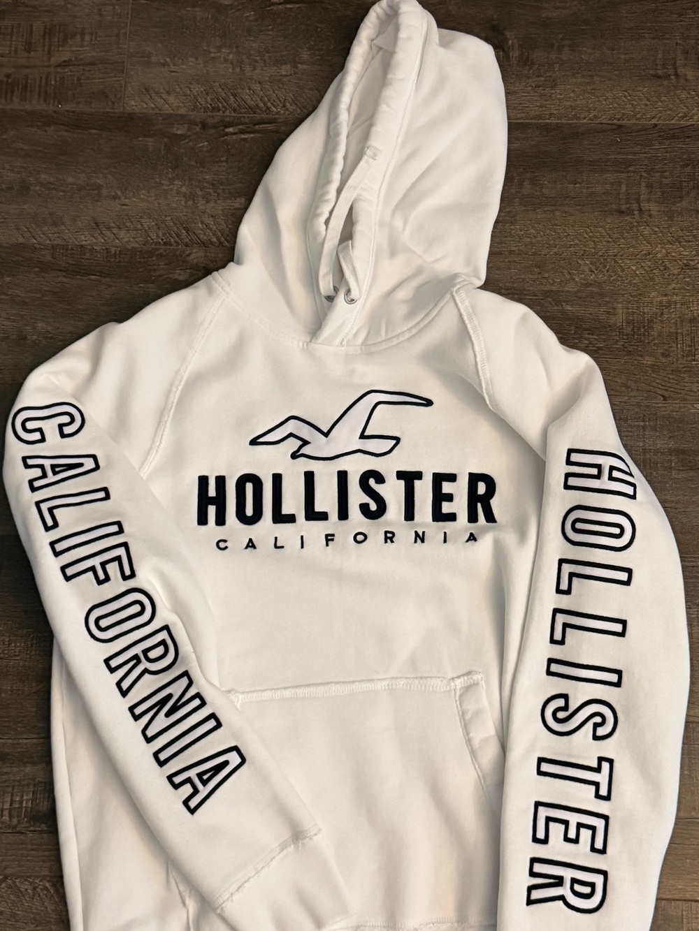 Hollister White Pullover with Black Logo Patch